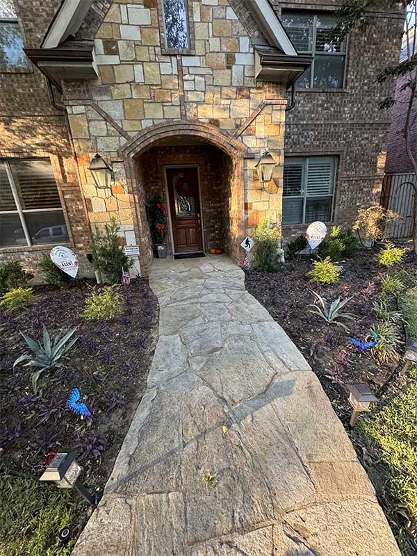 new flower beds in front of a home