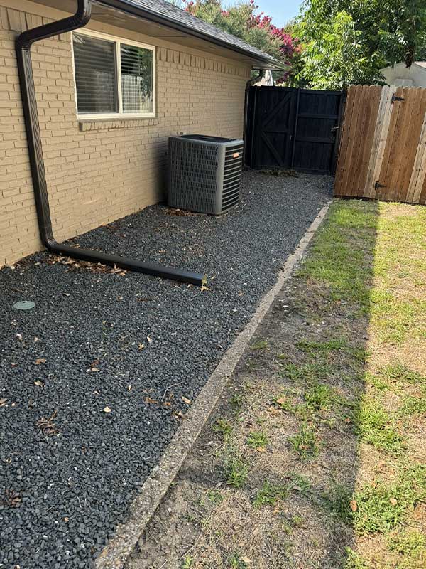 side of a house cleaned up with gravel