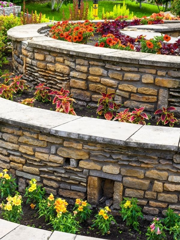 A two-tier stone retaining wall. 